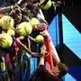 Jannik Sinner | Italy's Jannik Sinner signs autographs for fans at the end of the men's single final match at the ATP Finals tennis tournament, in Turin, on November 16, 2025 (Photo by Marco BERTORELLO / AFP)