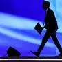 Britain's Prime Minister Rishi Sunak walks away after delivering a speech at the leaders summit of the COP27 climate conference at the Sharm el-Sheikh International Convention Centre, in Egypt's Red Sea resort city of the same name, on November 7, 2022. (Photo by AHMAD GHARABLI / AFP)