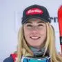 (FILES) US skier Mikaela Shiffrin smiles during the podium ceremony of the Women's Downhill race at the FIS Alpine Skiing World Cup event in St. Moritz, Switzerland, on December 9, 2023. American ski star Mikaela Shiffrin crashed heavily in the opening downhill race on January 26, 2024 at the Italian resort of Cortina d'Ampezzo, suffering a left leg injury but admitting she was "thankful it's not worse". Overall World Cup leader Shiffrin, 28, lost balance off a jump before one of the toughest turns on the testing Olympia delle Tofane course, sliding into the side netting. (Photo by Fabrice COFFRINI / AFP)