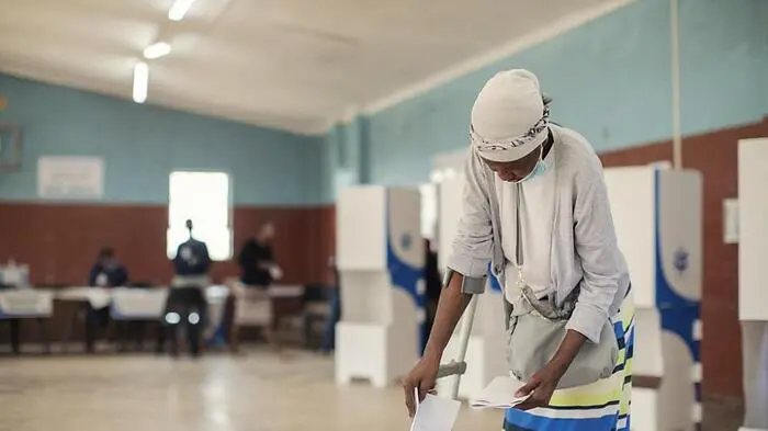 A woman casts her ballot at the Ohlange High School voting station, where former South African President Nelson Mandela voted for the first time in his life, in Durban on May 29, 2024, during South Africas general election. South Africans vote on May 29, 2024 in what may be the most consequential election in decades, as dissatisfaction with the ruling ANC threatens to end its 30-year political dominance. (Photo by GIANLUIGI GUERCIA / AFP)