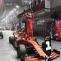 (FILES) In this file photo taken on September 22, 2019 Ferrari's German driver Sebastian Vettel (C) celebrates his victory at the end of the Formula One Singapore Grand Prix night race at the Marina Bay Street Circuit in Singapore. - Vettel will leave Ferrari at the end of the 2020 season, AFP reports on May 12, 2020. (Photo by Mladen ANTONOV / AFP)