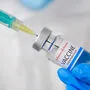 Johnson and johnson coronavirus Vaccine and syringe in the bottle or vial for injection in doctors hands. Covid-19, SARS-Cov-2 prevention, January 2021, San Francisco, USA.