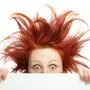 Redhead woman with messy hair with copy space