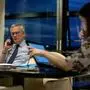 French Economy and Finance Minister Bruno Le Maire is seen speaking on the phone in his office, next to his advisor Juliette Oury (R), during a break of a Eurogroup videoconference meeting of the eurozone finance ministers to discuss coronavirus response on April 7, 2020 at the French Economy ministry in Paris. - EU finance ministers hope to agree a coronavirus economic rescue package for the worst-hit member states on Tuesday, but will fall short of demands from beleaguered Spain and Italy. (Photo by Thomas SAMSON / AFP)