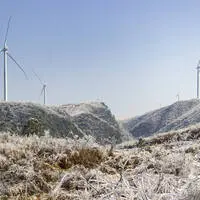 Windmills on snowy mountains PUBLICATIONxNOTxINxCHN 634113154942107971