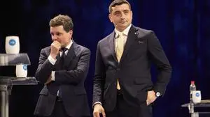 FILE - Presidential candidates Nicusor Dan, left, and George Simion take a break during a live electoral debate ahead of the second round of the country's presidential election redo in Bucharest, Romania, Thursday night, May 8, 2025. (AP Photo/Vadim Ghirda, File)