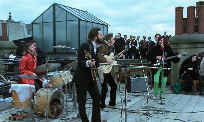  Ringo Starr, Paul McCartney, John Lennon and George Harrison, with Yoko Ono, seated right, in a scene from the nearly 8-hour Peter Jackson-produced documentary "Get Back"