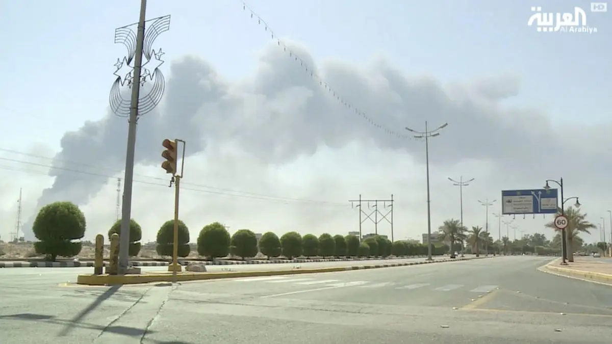 In this image made from a video broadcast on the Saudi-owned Al-Arabiya satellite news channel on Saturday, Sept. 14, 2019, smoke from a fire at the Abqaiq oil processing facility can be seen in Buqyaq, Saudi Arabia. Drones launched by Yemen's Houthi rebels attacked the world's largest oil processing facility in Saudi Arabia and another major oilfield Saturday, sparking huge fires at a vulnerable chokepoint for global energy supplies. (Al-Arabiya via AP) TV OUT NO SALES