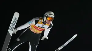 Domen Prevc, of Slovenia, soars through the air during his qualification jump at the first stage of the Four Hills ski jumping tournament in Oberstdorf, Germany, Sunday, Dec. 28, 2025. (AP Photo/Matthias Schrader)