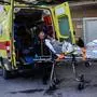 Medical staffs carry on a stretcher a survivor from the Comoros-flagged cargo ship that has sunk off the island of Lesbos, at a hospital on Lesbos Island on November 26, 2023. A Comoros-flagged cargo ship with 14 people on board has sunk off the island of Lesbos in gale-force winds, the Greek coastguard said on November 26, 2023, prompting a major rescue operation. A navy helicopter picked up one crew member of the RAPTOR cargo ship, according to the coastguard, who has been taken to Lesbos General Hospital. (Photo by Manolis LAGOUTARIS / AFP)