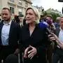 French newly-elected Member of Parliament and Rassemblement National (RN) far-right party's leader Marine Le Pen talks to journalists as she arrives to welcome MPs for a welcoming day at the National Assembly following the second round of France's legislative election in Paris on July 10, 2024.  (Photo by ALAIN JOCARD / AFP)