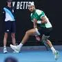 Russia's Karen Khachanov hits a return against Italy's Jannik Sinner during their men's singles match on day eight of the Australian Open tennis tournament in Melbourne on January 21, 2024. (Photo by David GRAY / AFP) / -- IMAGE RESTRICTED TO EDITORIAL USE - STRICTLY NO COMMERCIAL USE --
