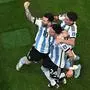Argentina's midfielder #24 Enzo Fernandez (C) celebrates scoring his team's second goal with Argentina's forward #10 Lionel Messi (L) during the Qatar 2022 World Cup Group C football match between Argentina and Mexico at the Lusail Stadium in Lusail, north of Doha on November 26, 2022. (Photo by MANAN VATSYAYANA / AFP)