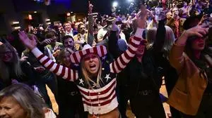 Supporters cheer at an election night watch party for Republican Montana Senate candidate Tim Sheehy, Tuesday, Nov. 5, 2024, in Bozeman, Mt. (AP Photo/Tommy Martino)