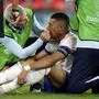 Kylian Mbappe of France receives a treatment after suffering an injury during a Group D match between Austria and France at the Euro 2024 soccer tournament in Duesseldorf, Germany, Monday, June 17, 2024. (AP Photo/Alessandra Tarantino)