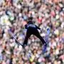 Naoki Nakamura, of Japan, soars through the air during his first round jump of the Men Team competition at the ski flying world championships, at the Kulmkogel mountain in Bad Mitterndorf, Austria, Sunday, Jan. 28, 2024. (AP Photo/Matthias Schrader)