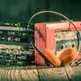 Closeup of cassette tape, red walkman and headphones,sujet