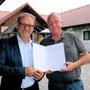 WK-Vizepräsident Andreas Herz gratuliert Heinz Turk zum Kommerzialratstitel