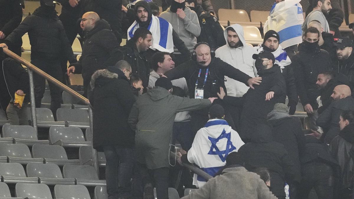 Fans argue on stands during the UEFA Nations League soccer match between France and Israel at the Stade de France stadium in Saint-Denis, outside Paris, Thursday Nov. 14, 2024. (AP Photo/Thibault Camus)