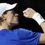 Italy's Jannik Sinner reacts to winning a ponint against Australia's Alex de Minaur during the second men's singles final tennis match between Australia and Italy of the Davis Cup tennis tournament at the Martin Carpena sportshall, in Malaga on November 26, 2023. (Photo by LLUIS GENE / AFP)