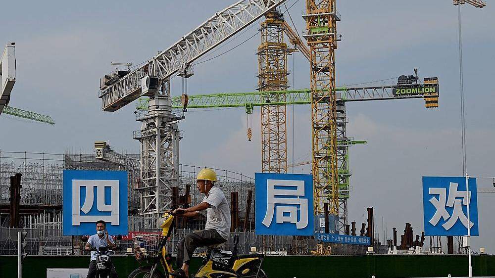 Der chinesische Baukonzern Evergrande will Anlager beruhigen. Nun hängt alles von der Entscheidung der Zentralregierung in Peking ab