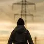 Sujet, Feature, Energie, Strom, Stromleitung, Strommast, Murauen, Auwiesen, Mann, Mensch, Sonnenuntergang, Abend, Strommasten, Hochspannung, Wasserkraft, Atomstrom,  Stromverbrauch, Energiewende, ökologisch, Graz, Murauen,  aufgenommen am 27.02.2017