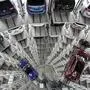 Volkswagen cars are lifted inside a delivery tower of the company in Wolfsburg, Germany, Tuesday, March 14, 2017. The CEO of German automaker Volkswagen says the United States remains a "core market" for the company despite its diesel emissions scandal and has underlined that it hopes to expand there. Matthias Mueller made the comments Tuesday at the company's annual news and investor conference at its headquarters in Wolfsburg, Germany. (AP Photo/Michael Sohn)