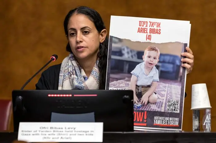 Ofri Bibas Levy, Sister of Yarden Bibas held hostage with his wife and two children Kfir and Ariel in the Gaza Strip by Palestinian militant group Hamas after the October 7 attack, speaks during a press conference at the European Office of the United Nations, Palais des Nation, in Geneva on November 14, 2023. (Photo by PIERRE ALBOUY / AFP)