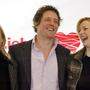 Fast zwanzig Jahre ist es her: Heike Makatsch, Hugh Grant und Laura Linney 2003 bei der Premiere von &quot;Tatsächlich... Liebe&quot; in München