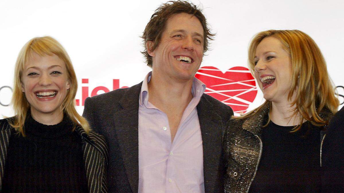 Fast zwanzig Jahre ist es her: Heike Makatsch, Hugh Grant und Laura Linney 2003 bei der Premiere von &quot;Tatsächlich... Liebe&quot; in München