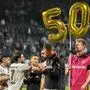 Leverkusen players display a "50" marking their 50th unbeaten game of the season after the German first division Bundesliga football match between VfL Bochum and Bayer 04 Leverkusen in Bochum, western Germany on May 12, 2024. Bayer Leverkusen stretched their season-long unbeaten run to 50 games with a 5-0 win at 10-man Bochum in the Bundesliga on Sunday.
Bochum defeated a 10-man Leverkusen in May 2023, the last side to beat Xabi Alonso's league champions in any competition, but the tables turned on Sunday with Leverkusen's goals coming from five different scorers. 
Alonso's Leverkusen are now just one game away from the first unbeaten Bundesliga season and three games from a remarkable treble. (Photo by INA FASSBENDER / AFP) / DFL REGULATIONS PROHIBIT ANY USE OF PHOTOGRAPHS AS IMAGE SEQUENCES AND/OR QUASI-VIDEO