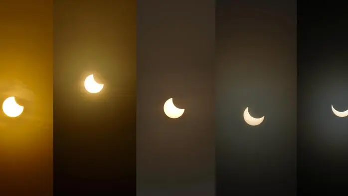 Das Bild zeigt verschiedene Phasen einer partiellen Sonnenfinsternis