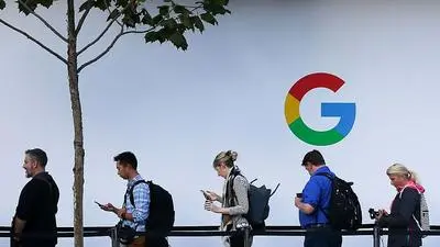 (FILES) In this file photo taken on October 4, 2017, people wait to enter a Google product launch event on at the SFJAZZ Center in San Francisco, California.
US President Donald Trump lashed out on July 19, 2018, after Brussels hit US tech giant Google with a record fine, and warned he would no longer allow Europe to take "advantage" of the United States. / AFP PHOTO / Elijah Nouvelage