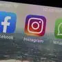 This photo shows the mobile phone app logos for, from left, Facebook, Instagram and WhatsApp in New York, Tuesday, Oct. 5, 2021. The six-hour outage was a headache for many casual users but far more serious for the millions of people worldwide who rely on the social media sites to run their businesses or communicate with relatives, fellow parents, teachers or neighbors. (AP Photo/Richard Drew)