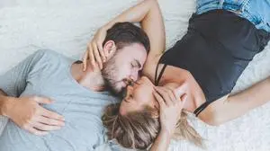 Happy couple lover on bed, hug and kiss in romantic time, love and passionate concept.