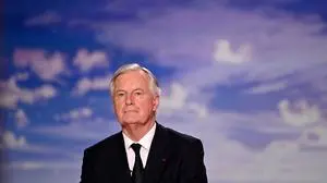 French Prime Minister Michel Barnier takes part in the evening news broadcast of French TV channel France 2 at the France Televisions studios in Paris, on September 22, 2024. (Photo by Julie SEBADELHA / POOL / AFP)