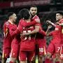 Liverpool's Cody Gakpo, center, celebrates scoring their side's first goal of the gameduring the English Premier League soccer match between Liverpool and Manchester City at Anfield Stadium, Liverpool, England, Sunday Dec. 1, 2024.  (Peter Byrne/PA via AP)
