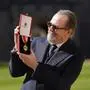 Actor Gary Oldman poses for a photo after being made a Knight Bachelor at an investiture ceremony at Windsor Castle, in Windsor, England, Tuesday, Sept. 30, 2025. (Andrew Matthews/Pool Photo via AP)