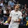 Austria's Sebastian Ofner reacts after a point against Australia's Thanasi Kokkinakis during their men's singles match on day three of the Australian Open tennis tournament in Melbourne on January 16, 2024. (Photo by Lillian SUWANRUMPHA / AFP) / -- IMAGE RESTRICTED TO EDITORIAL USE - STRICTLY NO COMMERCIAL USE --