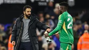 Manchester United's Portuguese head coach Ruben Amorim (L) shakes hands with Manchester United's Cameroonian goalkeeper #24 Andre Onana (R) at the end of the English Premier League football match between Ipswich Town and Manchester United at Portman Road in Ipswich, eastern England on November 24, 2024. Ipswich Town and Manchester United equalised 1 - 1. (Photo by Darren Staples / AFP) / RESTRICTED TO EDITORIAL USE. No use with unauthorized audio, video, data, fixture lists, club/league logos or 'live' services. Online in-match use limited to 120 images. An additional 40 images may be used in extra time. No video emulation. Social media in-match use limited to 120 images. An additional 40 images may be used in extra time. No use in betting publications, games or single club/league/player publications. / 