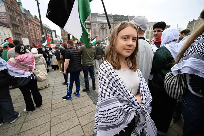 Swedish climate activist Greta Thunberg (C) attends a rally in Malmo, Sweden, in protest against Israel's participation in the 68th edition of the Eurovision Song Contest (ESC) on May 9, 2024. (Photo by Johan Nilsson/TT / TT NEWS AGENCY / AFP) / Sweden OUT