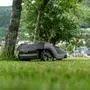 Norway - 12 July 2023: Husqvarna lawn mower robot cutting grass. Mowing robot on a green lawn *** Husqvarna Rasenmäher Roboter beim mähen von Gras. Mähroboter auf einer grünen Wiese