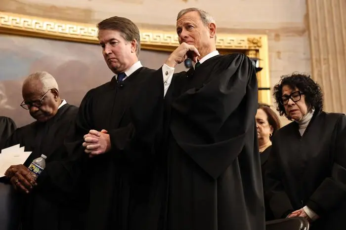 (FILES) (From L-R) US Associate Supreme Court Justices Clarence Thomas and Brett Kavanaugh, US Supreme Court Chief Justice John Roberts and US Supreme Court Associate Justice Sonia Sotomayor bow their heads during inauguration ceremonies in the Rotunda of the US Capitol on January 20, 2025 in Washington, DC. Roberts issued a rare rebuke of President Trump on March 18, 2025, over his attack against a federal judge, bringing a smoldering conflict between the Republican and the judiciary into the open, US media reported. (Photo by Chip Somodevilla / POOL / AFP)