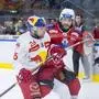 SALZBURG,AUSTRIA,12.APR.24 - ICE HOCKEY - ICE Hockey League, play off final, EC Red Bull Salzburg vs Klagenfurter AC. Image shows Peter Hochkofler (EC RBS) and Manuel Ganahl (KAC). Photo: GEPA pictures/ Gintare Karpaviciute