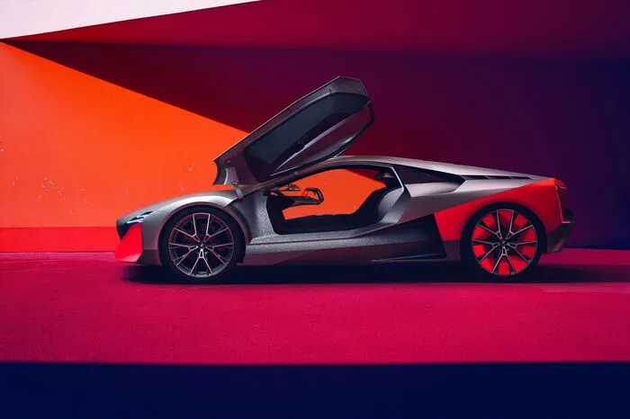 Und die sieht stark wie ein Vorgeschmack auf die nächste Generation des Plug-in-Hybrid i8 aus. Die flache, keilförmige Silhouette, die Flügeltüren, Karosserieteile aus Carbon und das auffällige Farbkonzept – alles da.