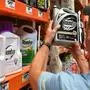 (FILES) In this file photo taken on July 09, 2018  customer Gary Harms shops for Roundup products at a store in San Rafael, California. - Monsanto was ordered on March 27, 2019 to pay some $81 million to an American retiree who blames his cancer on the agribusiness giant's weedkiller Roundup. A San Francisco jury found the firm had been "negligent by not using reasonable care" to warn of the risks of its product, ordering it to pay Edwin Hardeman $75 million in punitive damages, $5.6 million in compensation and $200,000 for medical expenses. The same jury previously found that a quarter century exposure to Roundup, whose principal ingredient is controversial chemical glyphosate, was a "substantial factor" in giving the 70-year-old Hardeman non-Hodgkin's lymphoma. (Photo by JOSH EDELSON / AFP)