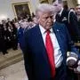US President Donald Trump holds a football as he departs a ceremony to present the Commander-in-Chief's Trophy to the US Naval Academy football team, the Navy Midshipmen, in the East Room of the White House on April 15, 2025 in Washington, DC. The trophy is presented annually to the winner of the college football series among the teams of the US Military Academy (Army Black Knights), the US Naval Academy (Navy Midshipmen), and the US Air Force Academy (Air Force Falcons). (Photo by Brendan Smialowski / AFP)