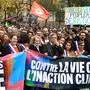 French leftwing politician Jean-Luc Melenchon, center, leads a protest march against the high cost of living and climate inaction in Paris, France, Sunday Oct. 16, 2022. Marchers are demanding wage increases, greater taxation of windfall profits and other steps to lessen the bite of rising inflation, heeding the call of left-wing parties and trade unionists hoping to crank up pressure on the government of French President Emmanuel Macron. (AP Photo/Aurelien Morissard)