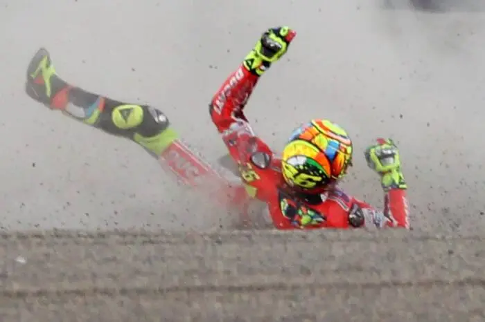 Oct. 2, 2011 - Motegi, Japan - VALENTINO ROSSI of Italy and Ducati Team crashes out after turn two