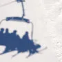 Shadow on the ski slope from the chair elevator with skiers and snowboarders. The problem of opening a ski resort in the COVID-19 pandemic.